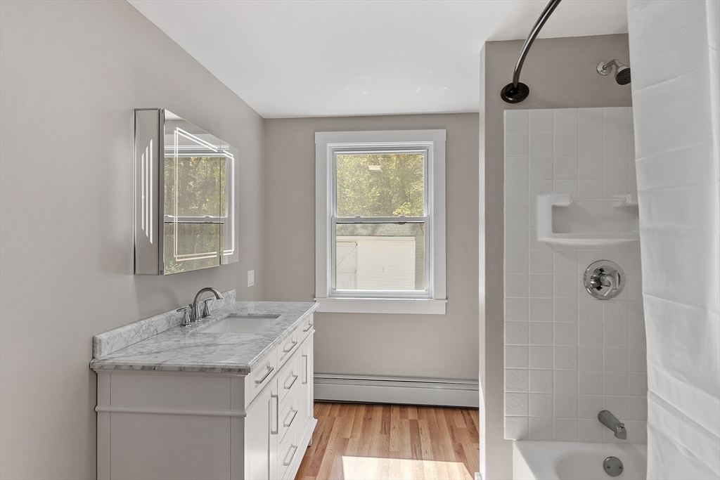34 Morse Road Royalston, MA 01368 - Photo 24 of 42 a bathroom with a granite countertop sink a mirror and a shower