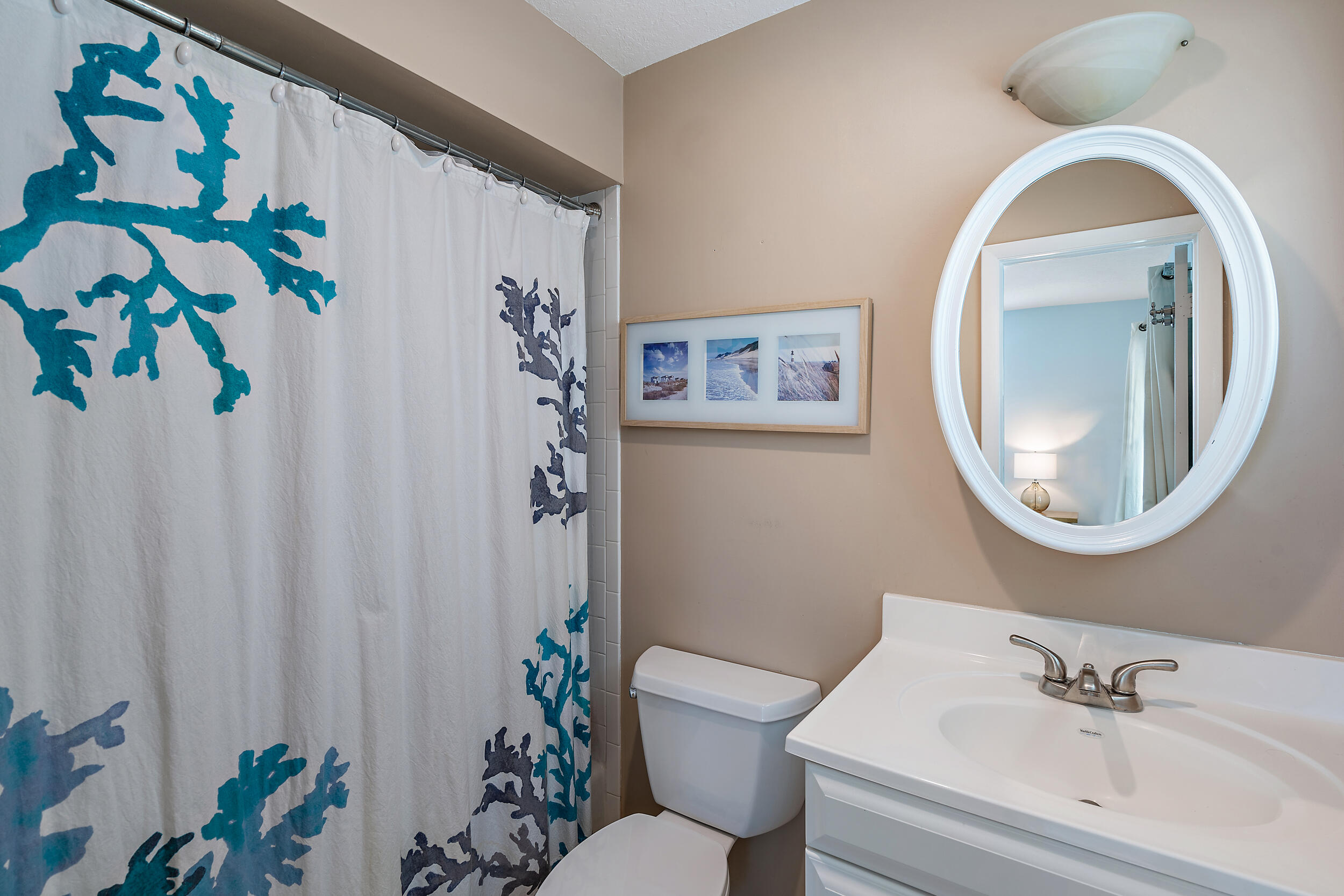 356 Mars Avenue Tequesta, FL 33469 - Photo 21 of 27 a bathroom with a toilet sink and mirror