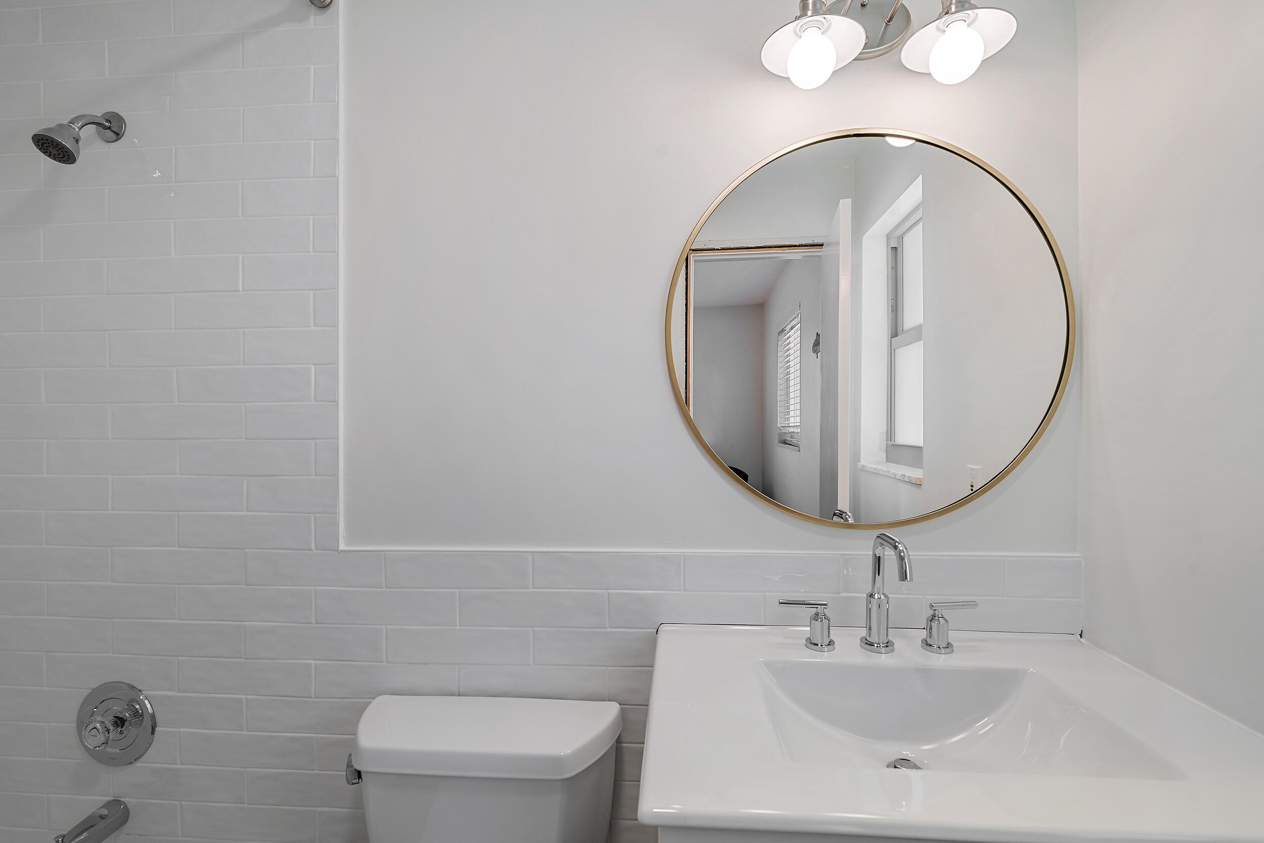 356 Mars Avenue Tequesta, FL 33469 - Photo 24 of 27 a bathroom with a toilet a sink and mirror