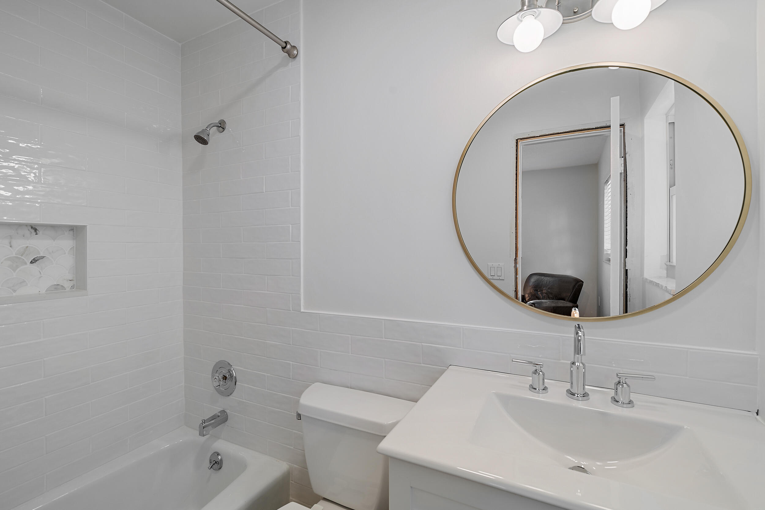 356 Mars Avenue Tequesta, FL 33469 - Photo 25 of 27 a bathroom with a sink a toilet and a mirror