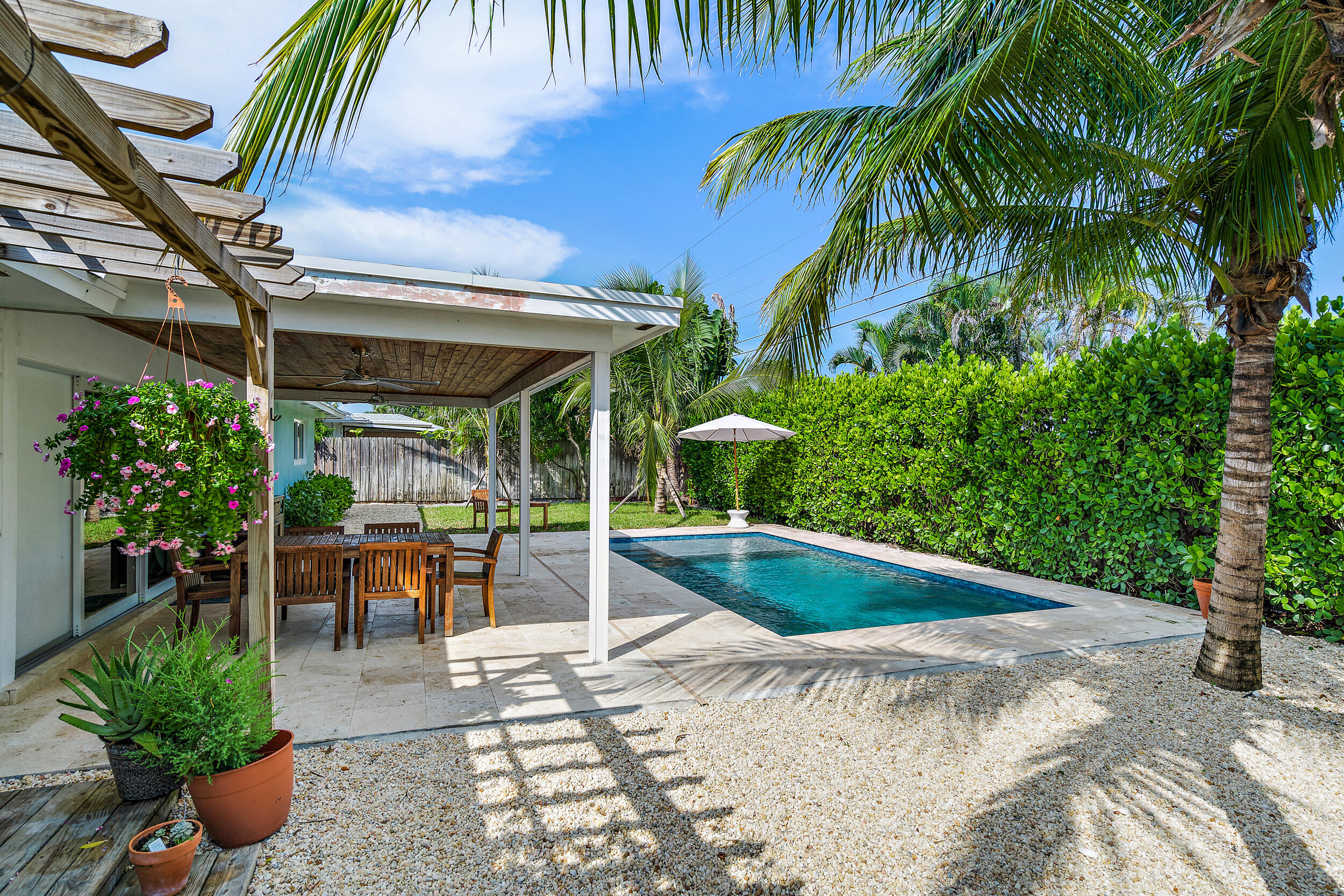 356 Mars Avenue Tequesta, FL 33469 - Photo 7 of 27 a view of a backyard with sitting area