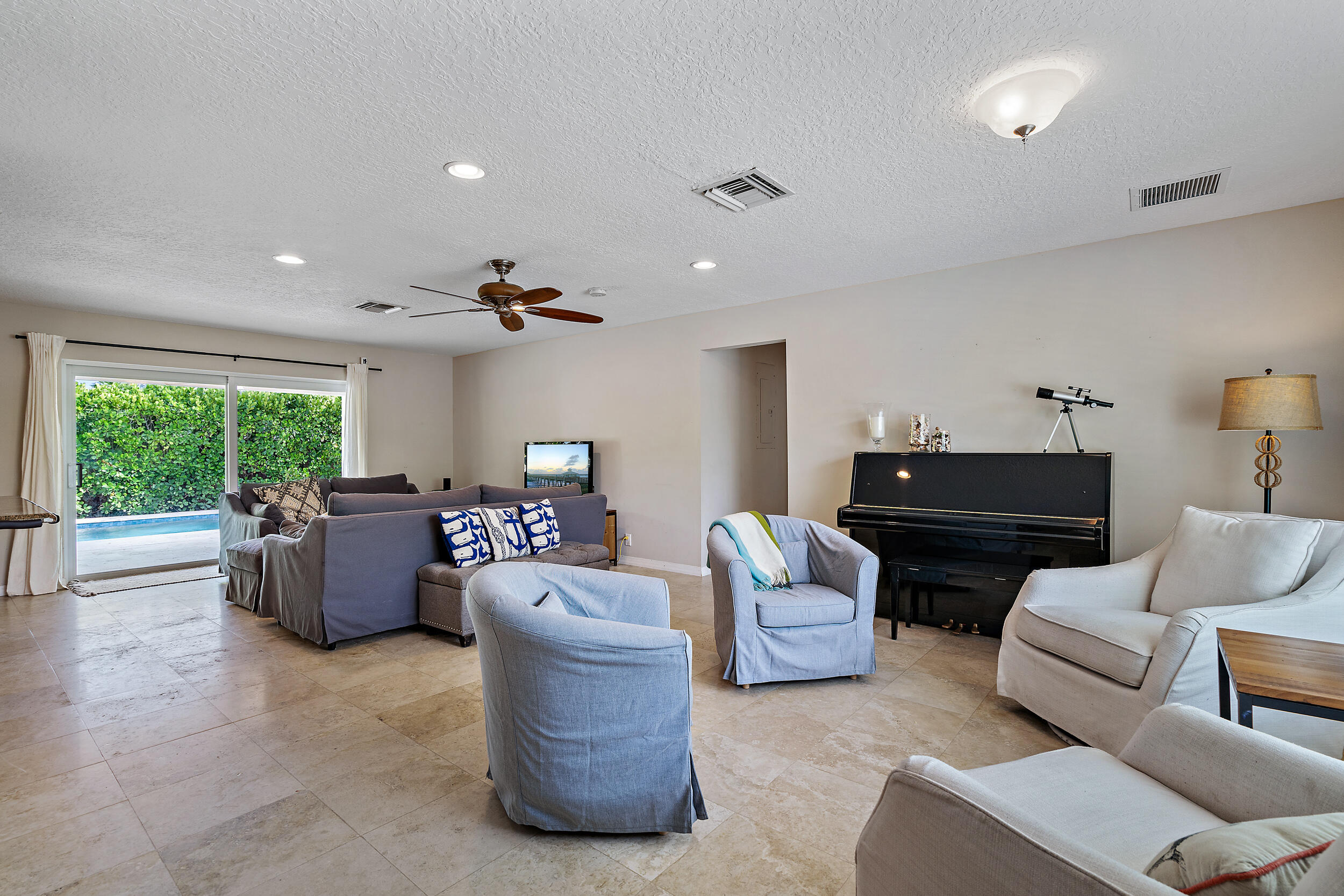 356 Mars Avenue Tequesta, FL 33469 - Photo 10 of 27 a living room with furniture and a large window