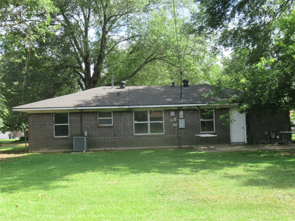 2513 Rosedale Place Bossier City, LA 71111 - Photo 10 of 13 Brick exterior with a dark shingle roof and multiple windows
