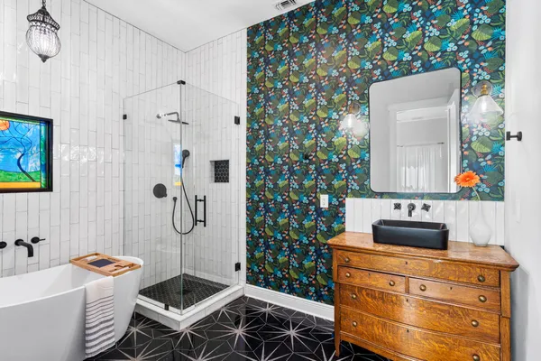 a bathroom with a sink toilet and shower