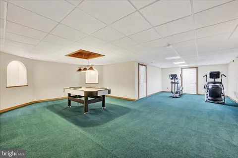 a living room with furniture and a table