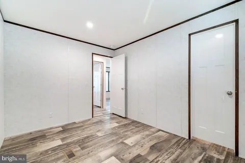 a view of a bathroom from a hallway
