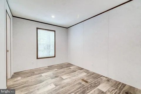 a white toilet sitting next to a shower