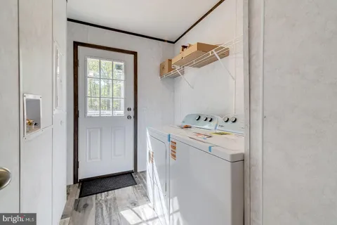 a bathroom with a sink toilet vanity and shower