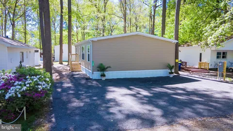 a house with trees in front of it