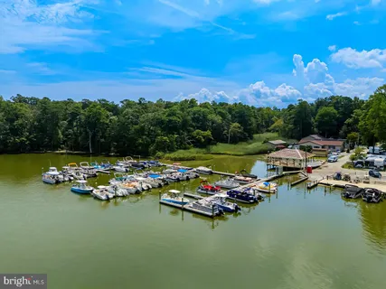 an aerial view of a house with a lake view