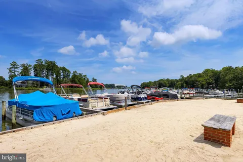 a view of swimming pool and outdoor seating