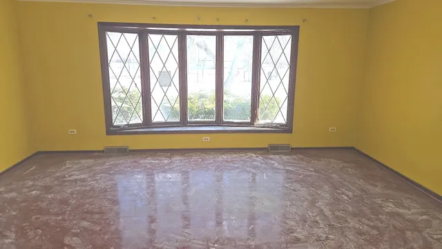 a view of a big room with windows