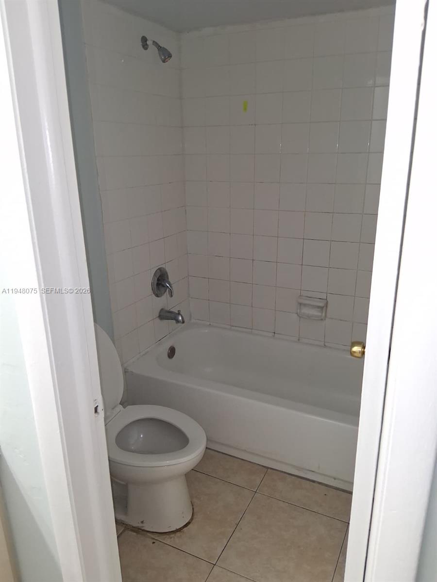 19791 Southwest 114th Avenue, Unit 135 Miami, FL 33157 - Photo 4 of 9 a bathroom with a toilet and a shower