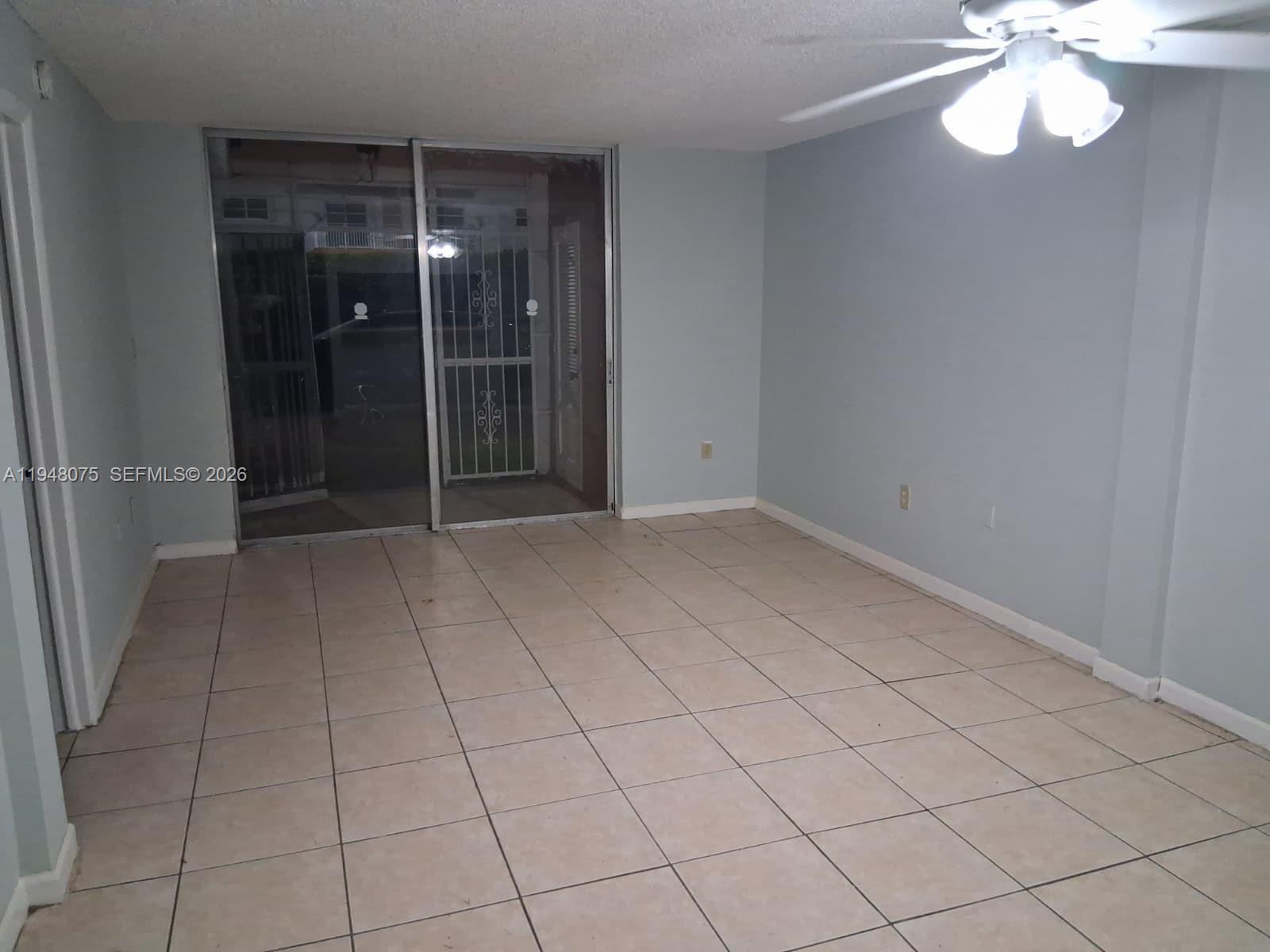 19791 Southwest 114th Avenue, Unit 135 Miami, FL 33157 - Photo 8 of 9 a view of an empty room and window