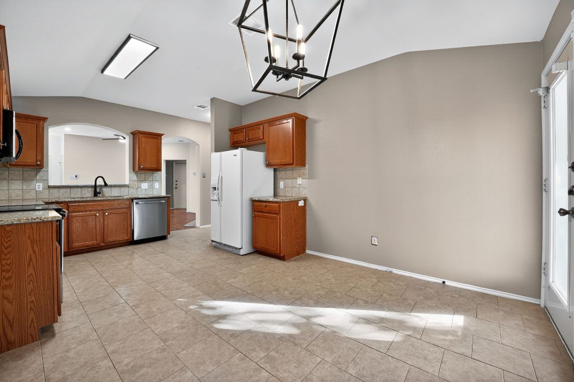 1502 McDowell Bend Leander, TX 78641 - Photo 19 of 31 a view of a kitchen with a sink
