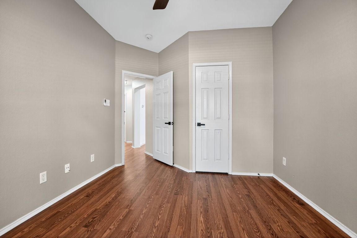 1502 McDowell Bend Leander, TX 78641 - Photo 26 of 31 a view of an empty room with wooden floor