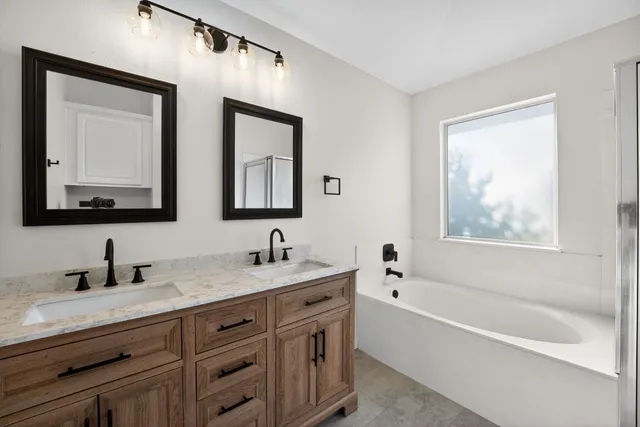 a bathroom with a sink a toilet and a bathtub