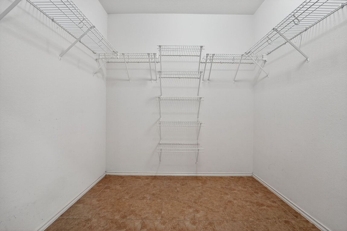 1502 McDowell Bend Leander, TX 78641 - Photo 31 of 31 a view of a room with racks on the wall