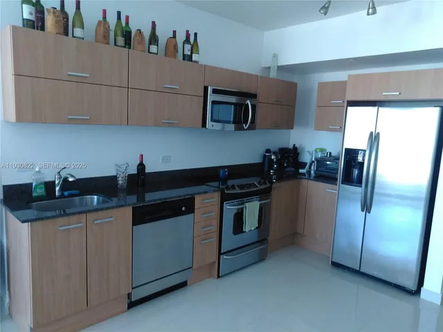 a bedroom with a bed and a lamp