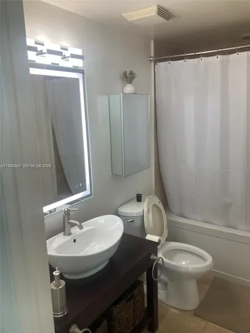 a bathroom with a sink and a toilet