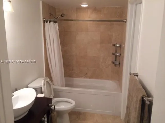 a kitchen with stainless steel appliances granite countertop a stove a refrigerator and a sink