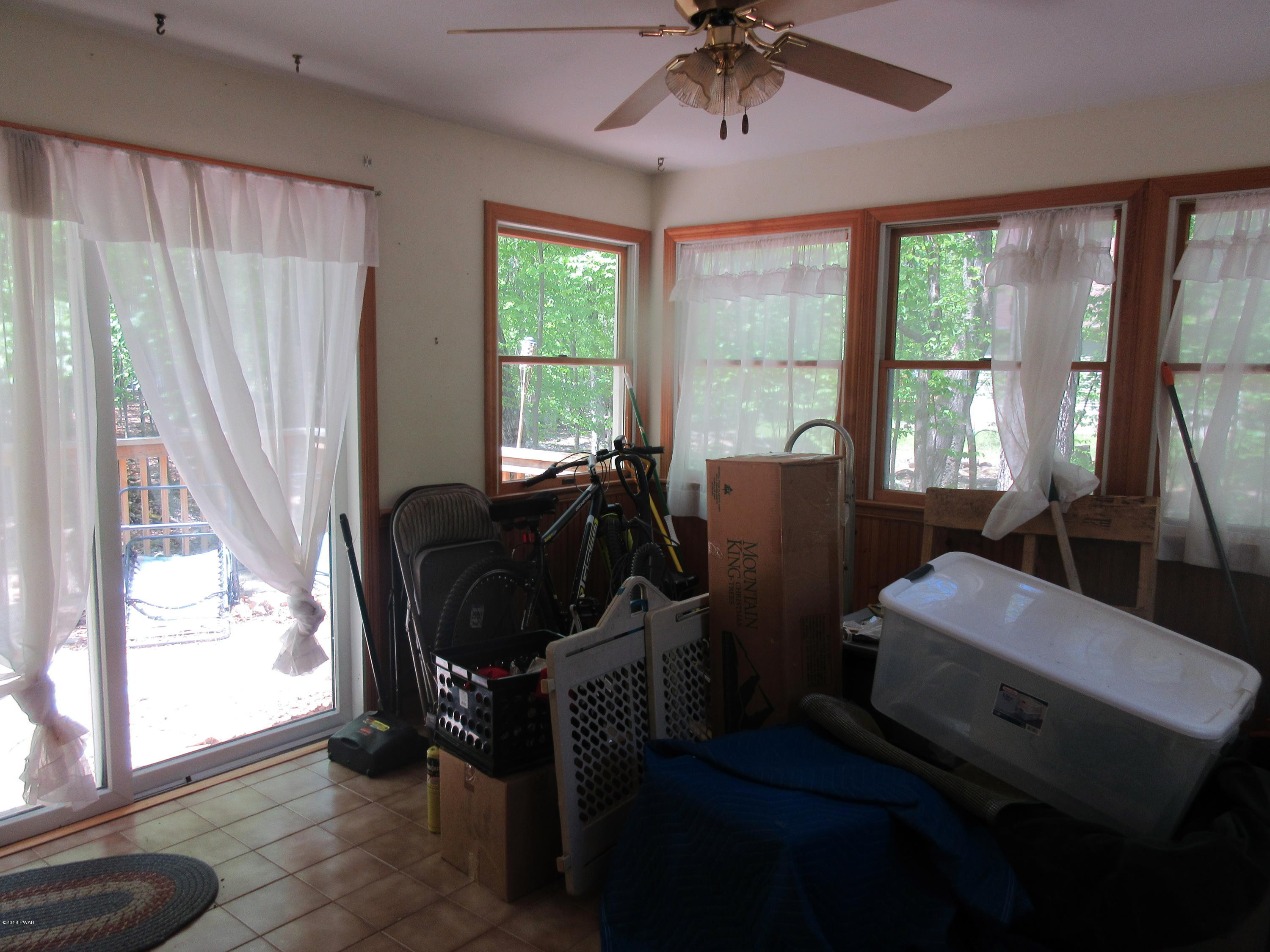 119 Skyview Road Dingmans Ferry, PA 18328 - Photo 9 of 12 a view of a workspace with furniture and a window