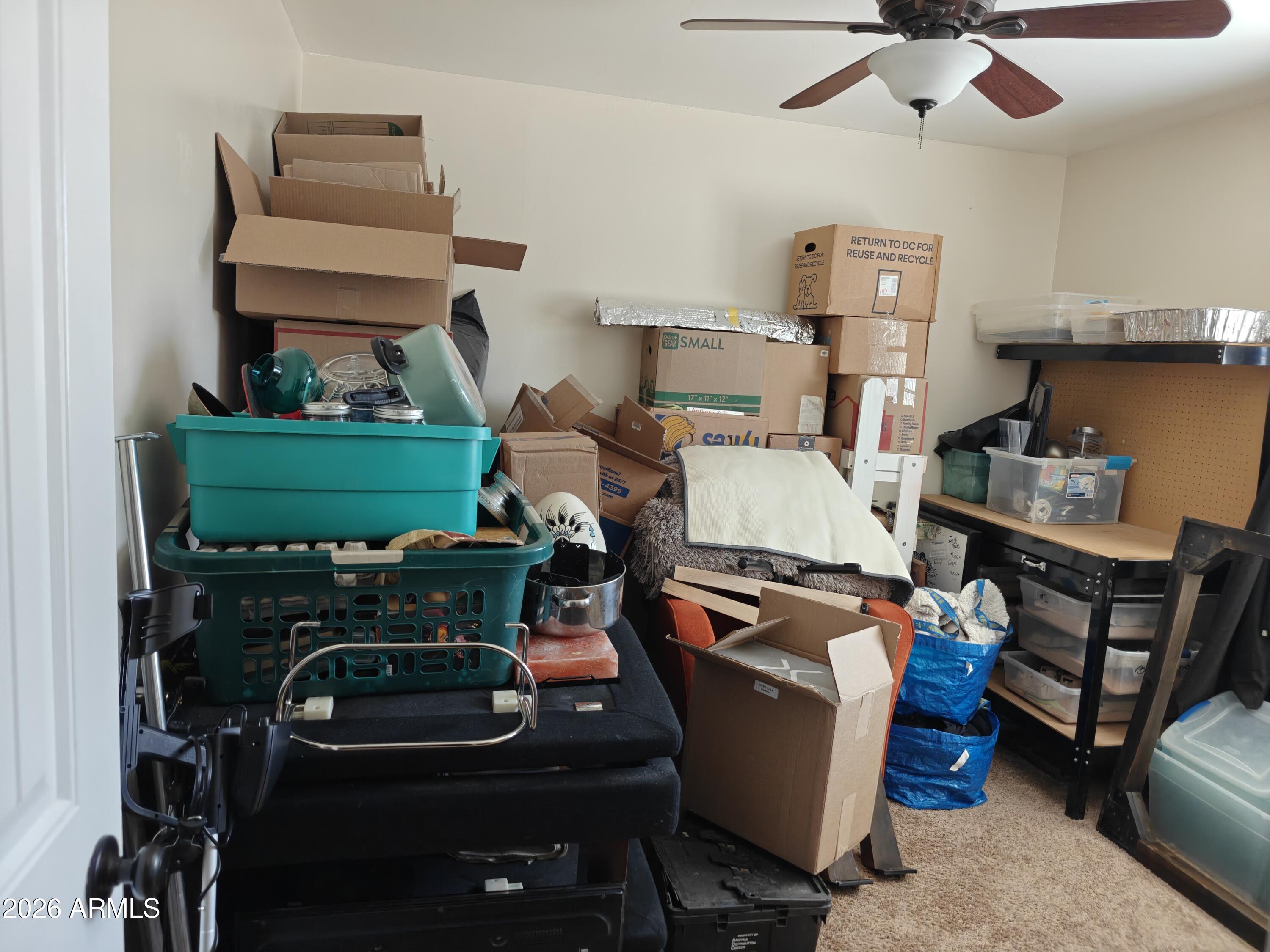 2417 West Roughrider Road New River, AZ 85087 - Photo 23 of 61 a room with furniture and a mirror