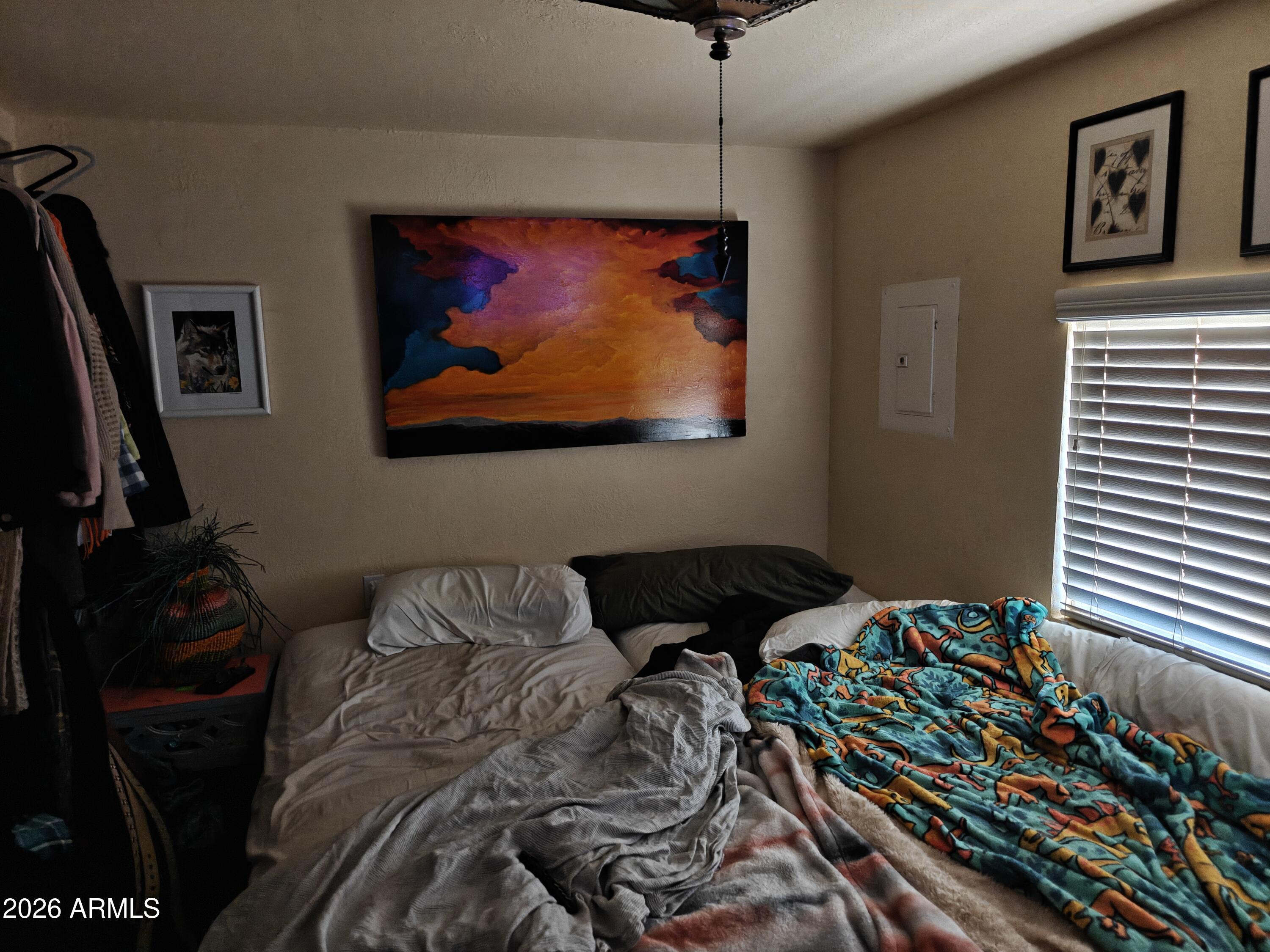 2417 West Roughrider Road New River, AZ 85087 - Photo 34 of 61 a bedroom with a bed and a flat screen tv