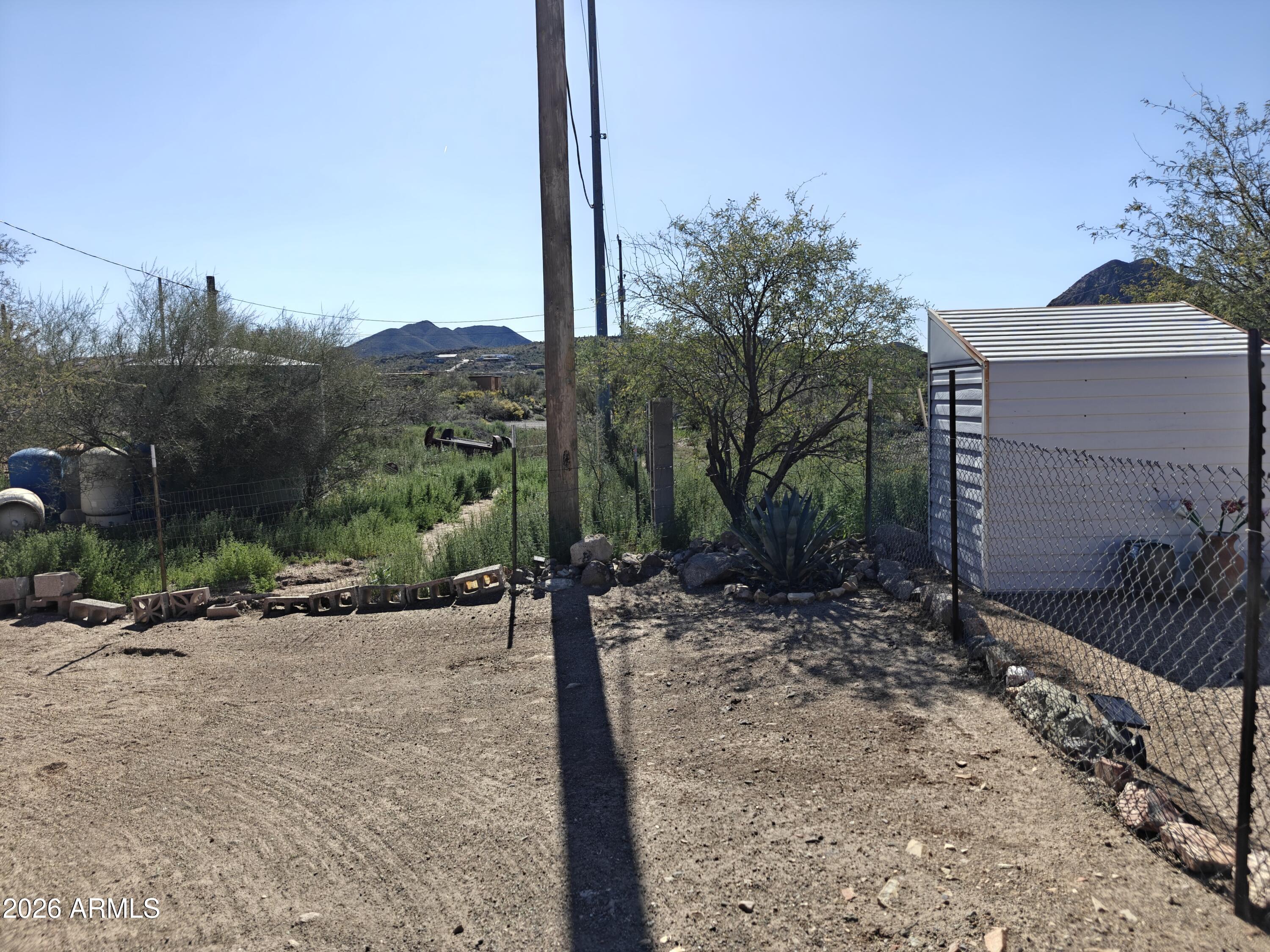 2417 West Roughrider Road New River, AZ 85087 - Photo 39 of 61 a view of a road with a tree in the background