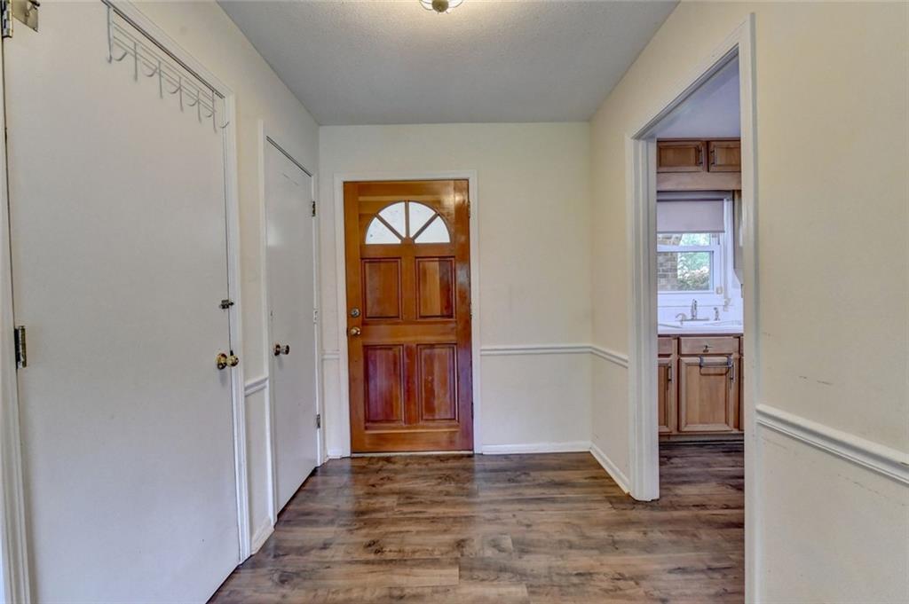 1577 Harbour Oaks Road Tucker, GA 30084 - Photo 5 of 58 a view of a hallway with wooden floor and closet