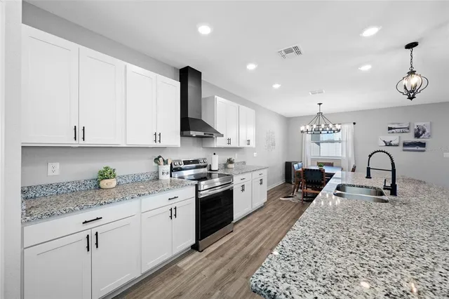 a en suite bathroom with a sink vanity and a mirror