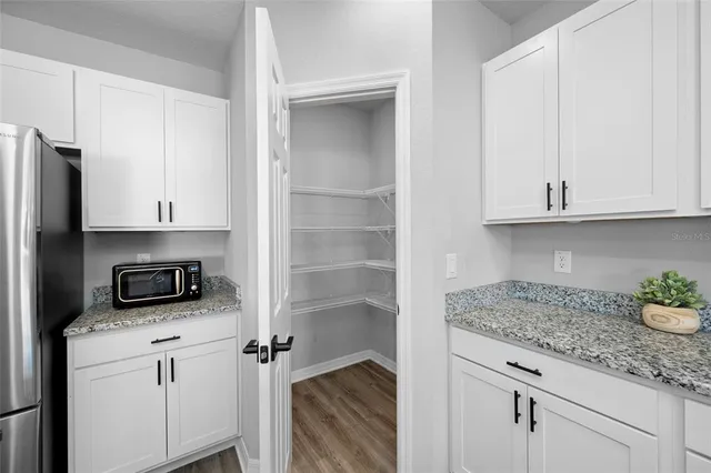 a view of a hallway with seating area