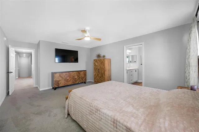 a living room with furniture gym equipment and a chandelier