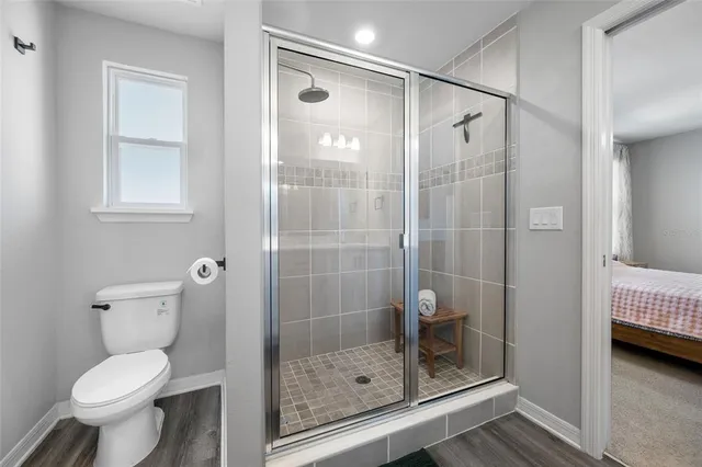 a en suite bathroom with double sink and a mirror