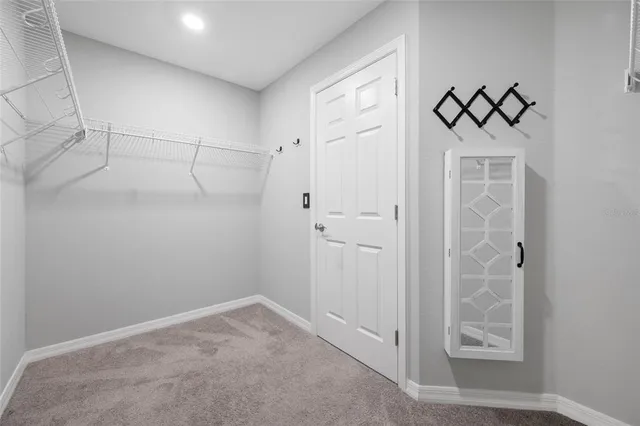 a white bath tub sitting next to a white toilet