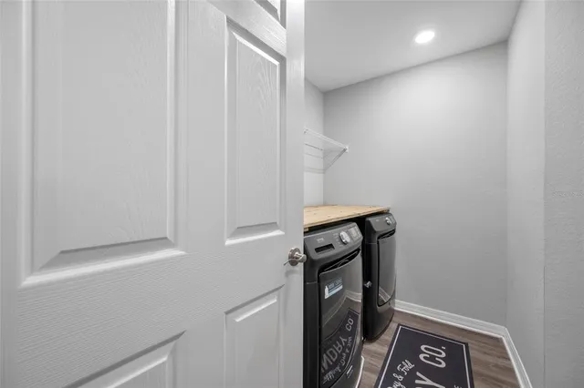 a view of house with a yard and porch