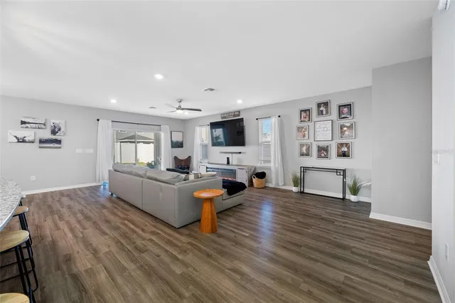a kitchen with white cabinets and appliances