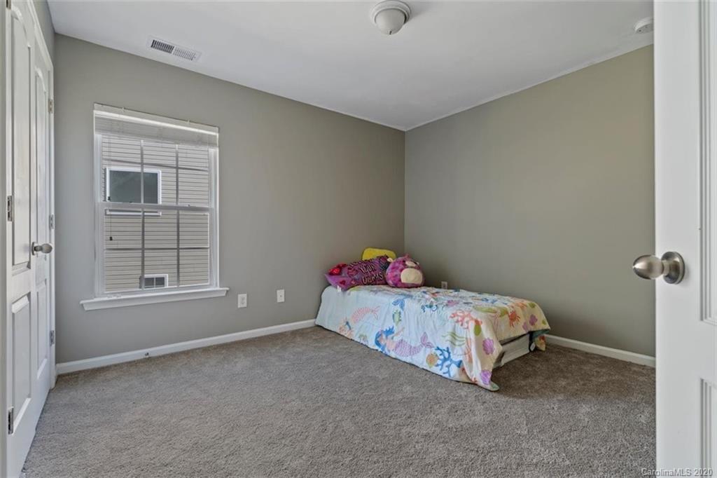 78106 Rillstone Drive Lancaster, SC 29720 - Photo 22 of 43 a bedroom with a bed and a window