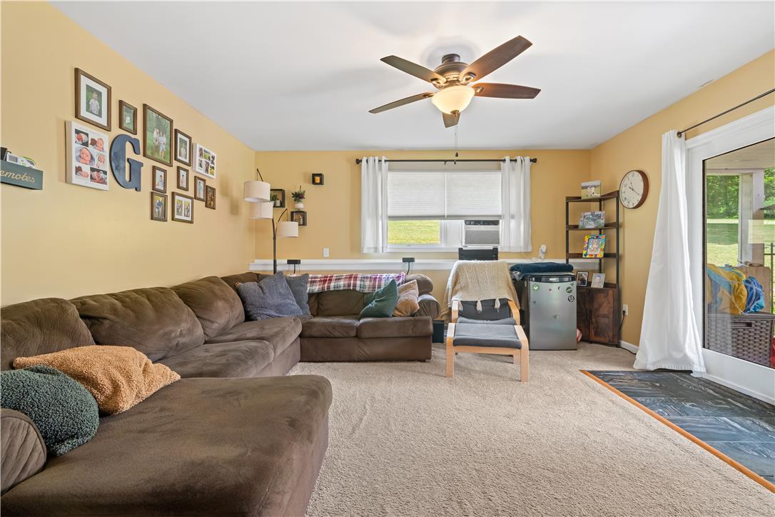 50 Kohls Road Northampton, PA 18067 - Photo 15 of 54 A well-lit family room offers comfortable living with a sliding glass door for outdoor access.