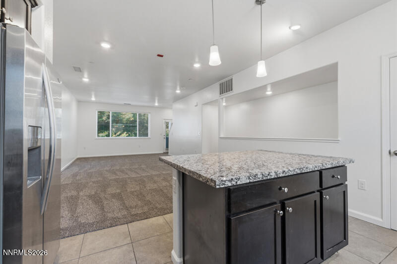 285 Mark Jeffrey Lane Reno, NV 89503 - Photo 5 of 20 a bathroom with a granite countertop sink a large mirror and shower