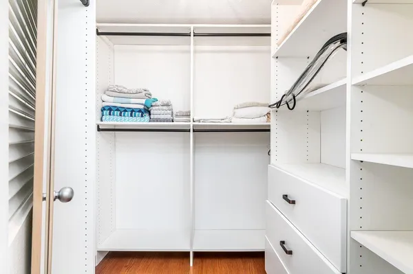 a view of a storage and utility room with closet