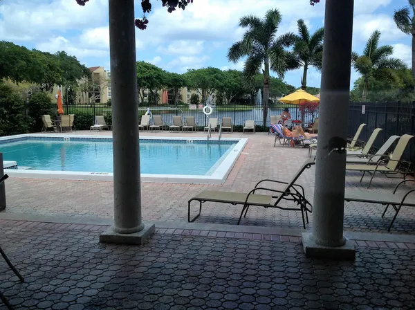 a view of a swimming pool with a patio