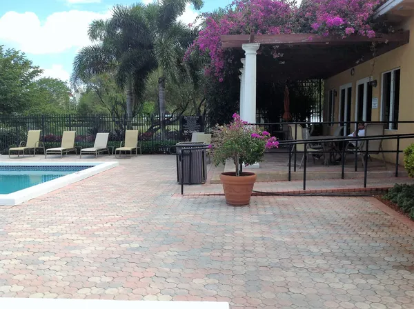 a view of a chairs and tables in the patio