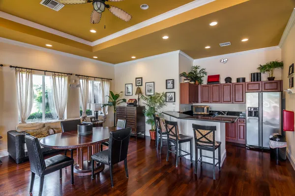 a view of a dining room with furniture window and wooden floor