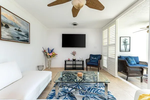 a living room with furniture and a flat screen tv
