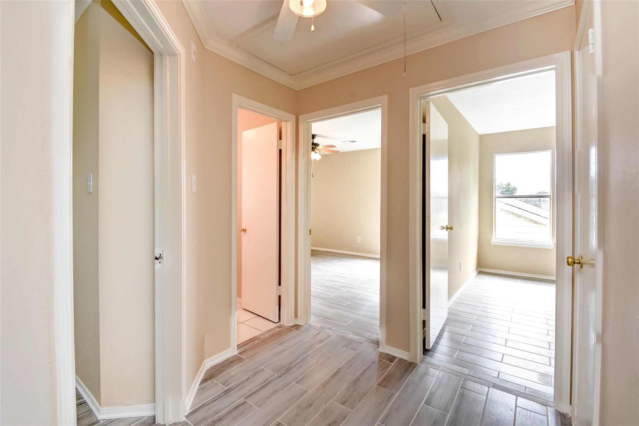 16811 Anna Green Street Houston, TX 77084 - Photo 26 of 27 a view of a hallway with wooden floor and closet