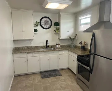 a kitchen with a stove and a refrigerator