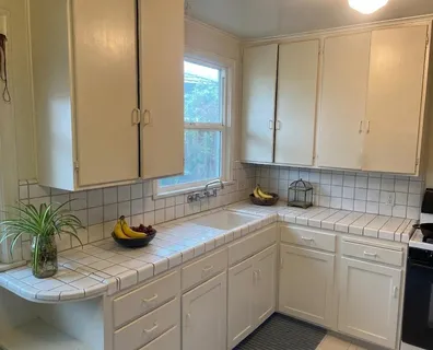 a kitchen with a sink and cabinets