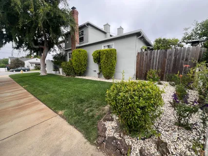 a backyard of a house with lots of green space
