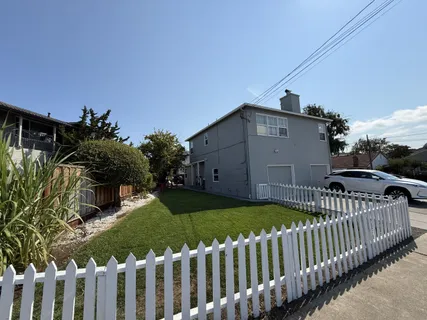 a view of a wooden fence and a bench